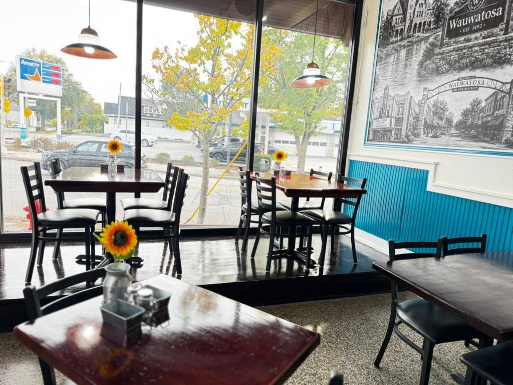 Window tables with sunflowers and the Wauwatosa mural