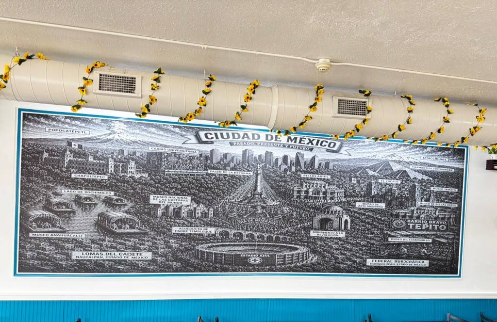Ciudad de México mural with sunflower garlands